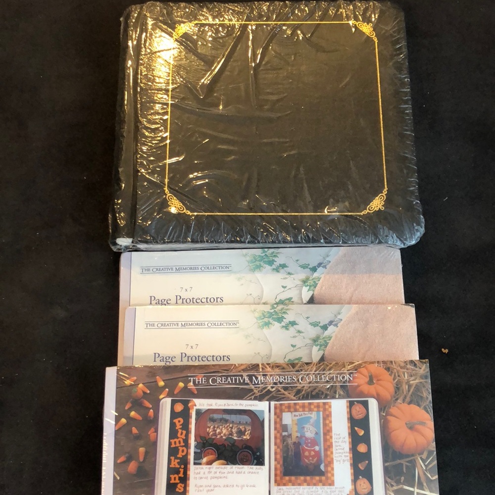 7x7 black scrapbook with extra pages and covers